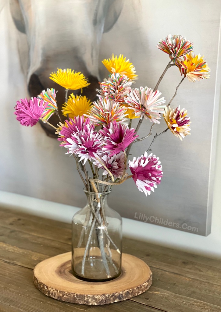 Easy crafts to make with things you have at home! These DIY cupcake liner flowers make for beautiful home decor. A great project for adults and teens to make at home when bored! This project is inexpensive, easy and so much FUN to make!