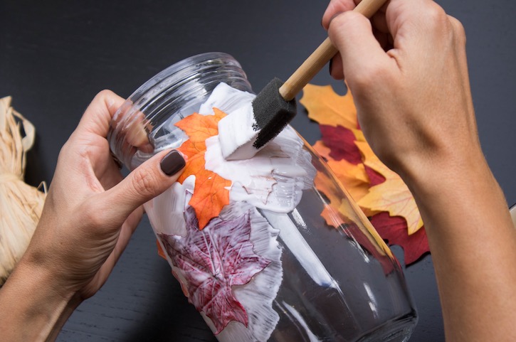 Easy step by step tutorial on how to make a DIY Fall Leaf candle holder using a mason jar and mod podge. 