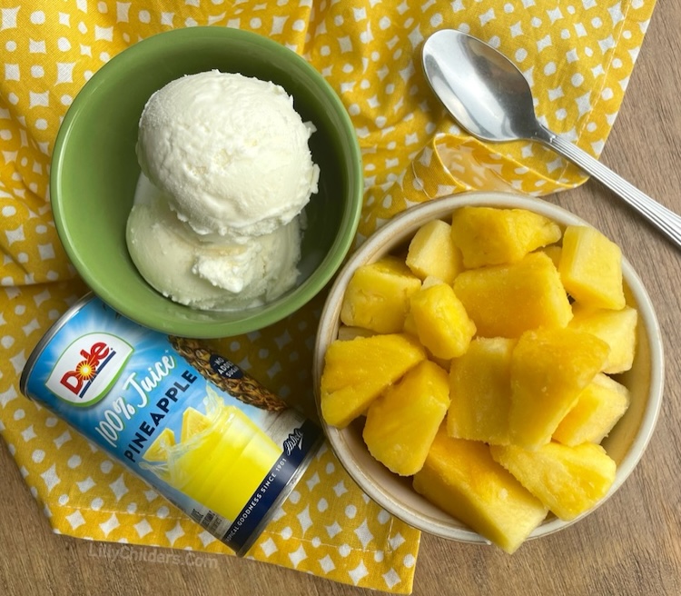 Ingredients needed to make Pineapple Dole Whip: 1 scoop vanilla ice cream, 2 cups frozen pineapple chunks, and half a cup of pineapple juice. Mix in your blender until smooth and creamy just like soft serve!