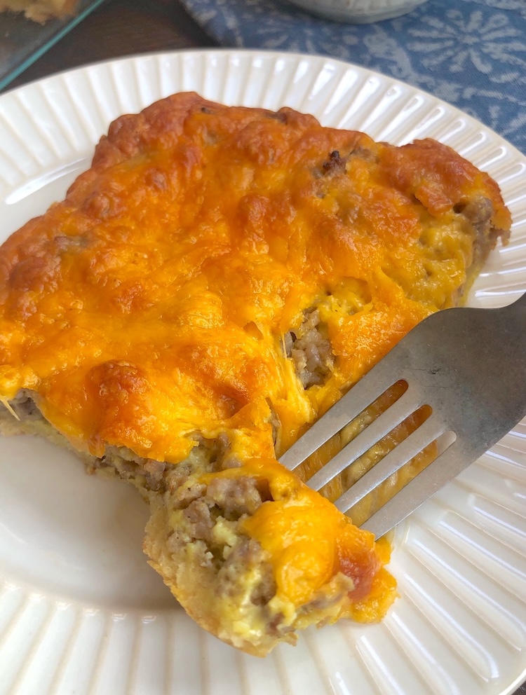 Delicious and comforting breakfast casserole made with a tube of refrigerated crescent dough, ground sausage, eggs, and shredded cheese. This breakfast only takes about 10 minutes to prepare and then the oven does all the work for you. Perfect for feeding a crowd at breakfast!