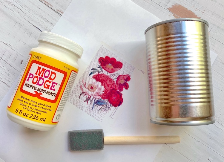 How to use mod podge and tin cans to make cute tin can containers to use as organizers or vases. 