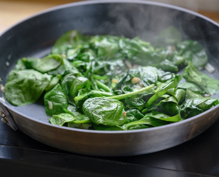 Spinach cooking in a pan. 
