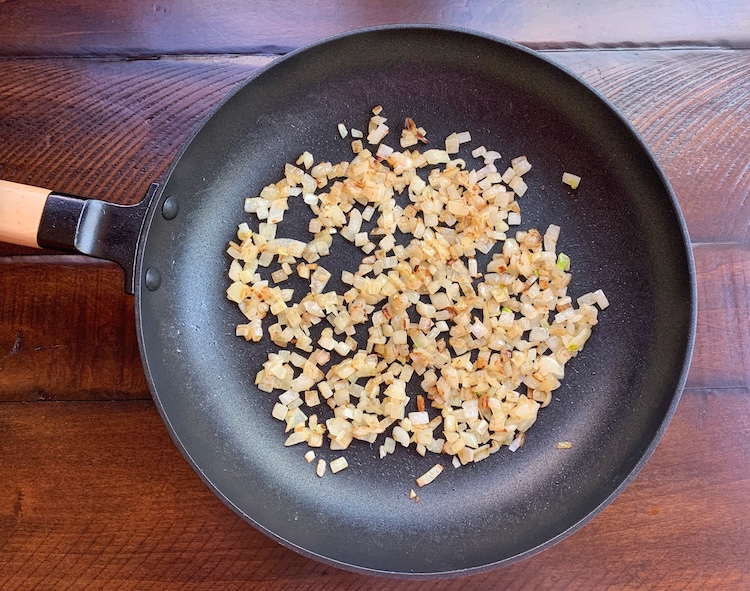 Grilled diced onions in a frying pan ready to make sloppy Joe pizza. 