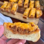 If you're looking for fun ground beef dinner ideas, try this easy Sloppy Joe Pizza made with French bread! It's cheesy finger food that's perfect for quick meals as well as simple party food.